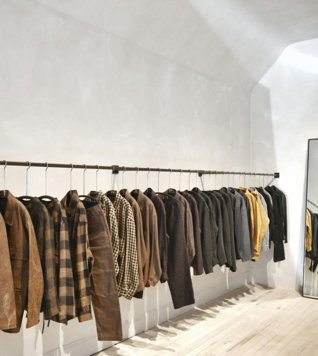a room with a wall of clothes on the wall